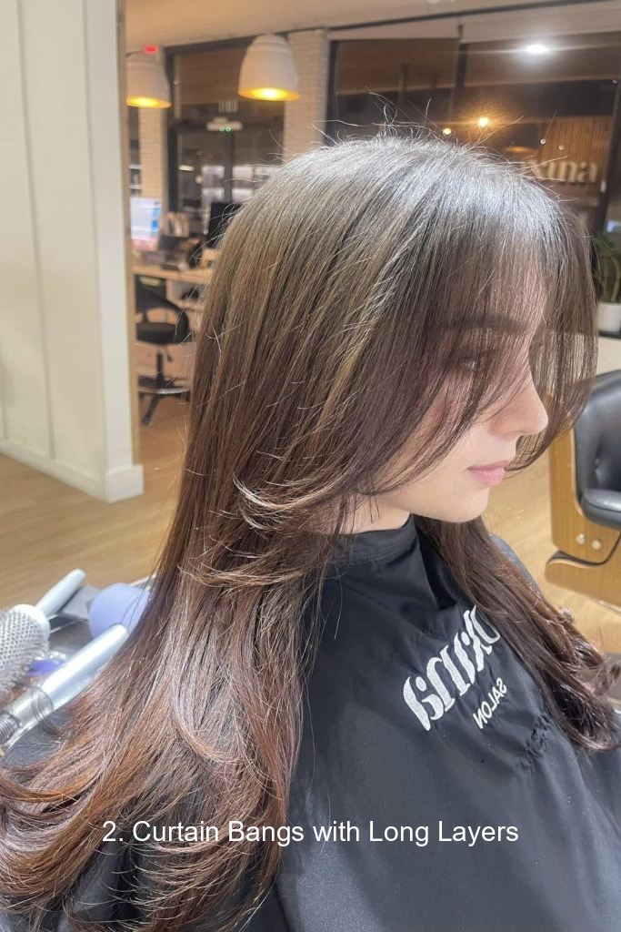 2. Curtain Bangs with Long Layers